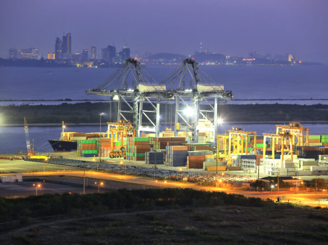 Industrial Container Cargo freight ship with working crane bridg