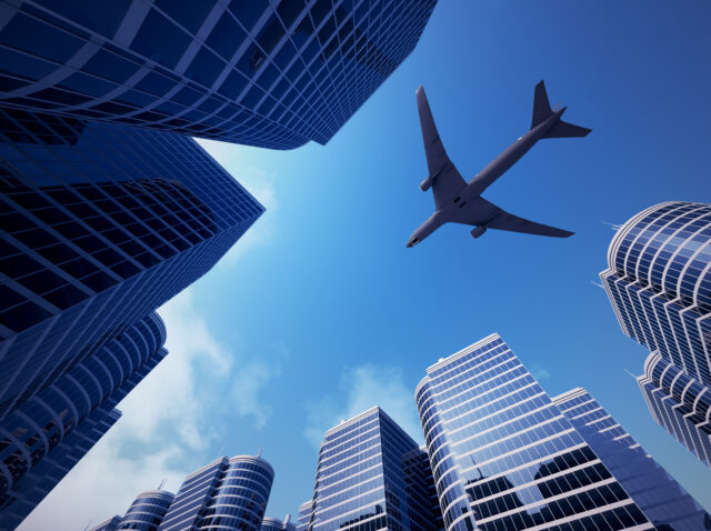 Business towers with a airplane silhouette